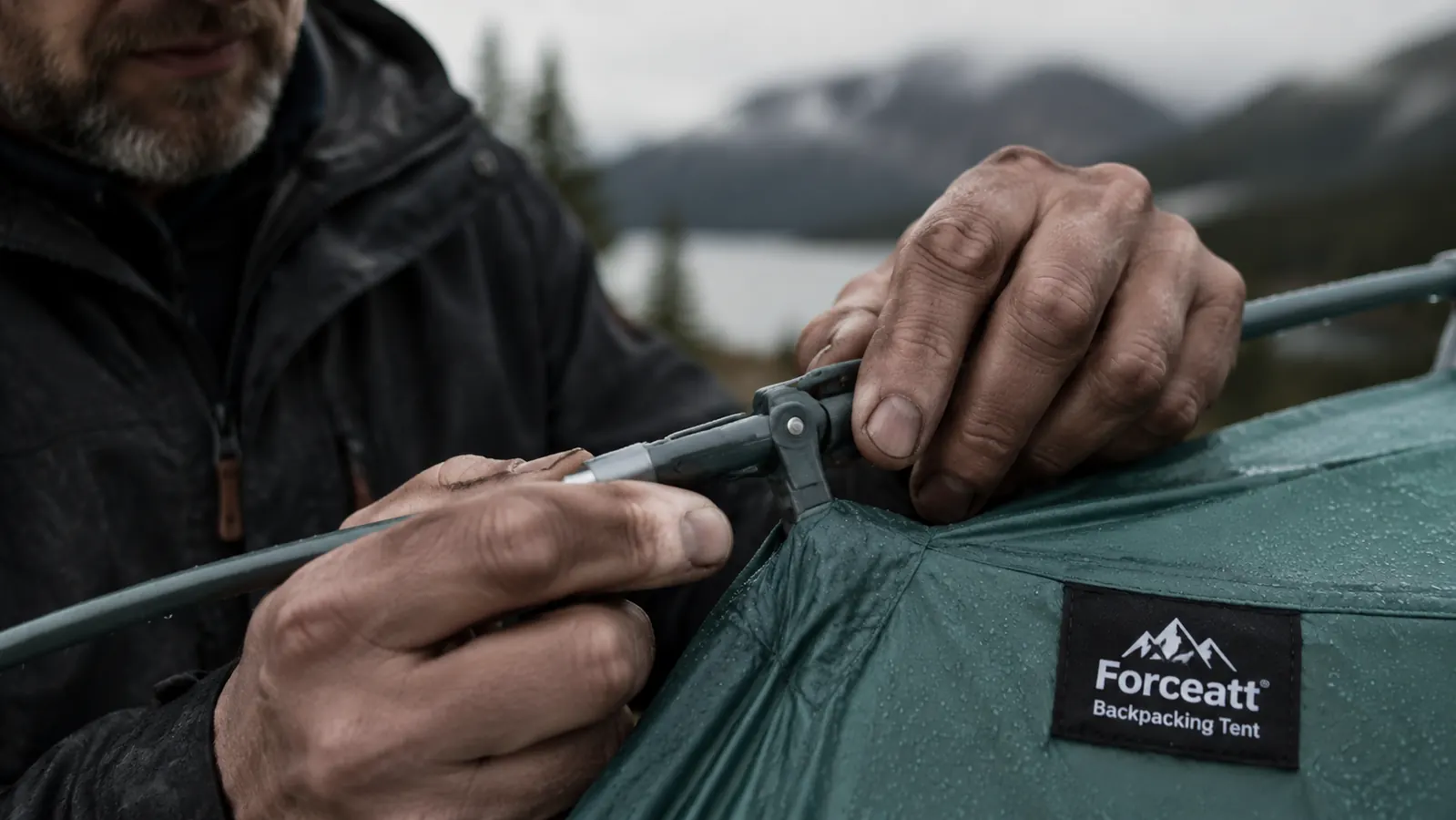 Close-up of tent pole clip with dirt and grit visible in the hinge mechanism