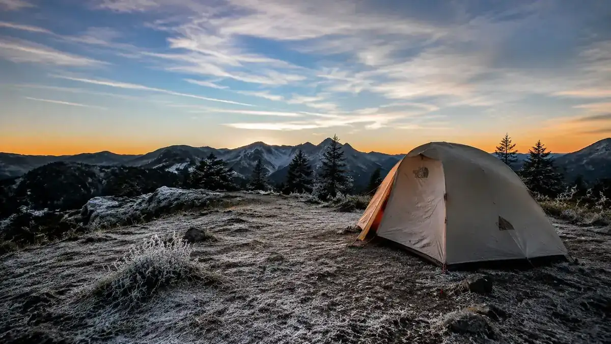 Campsite at 6000 feet in the North Cascades, October morning, frost on the ground, tent in the background